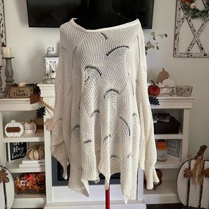 Women’s cream over-sized sweater with handkerchief hemline